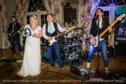 Bride-Groom-On-Stage-With-Live-Wedding-Band